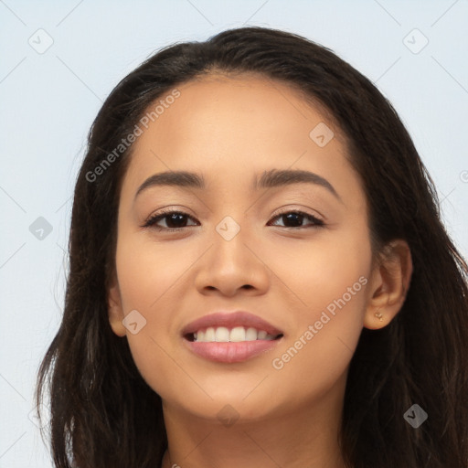 Joyful latino young-adult female with long  brown hair and brown eyes