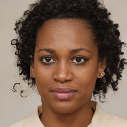 Neutral black young-adult female with medium  brown hair and brown eyes