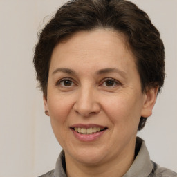 Joyful white adult female with short  brown hair and brown eyes