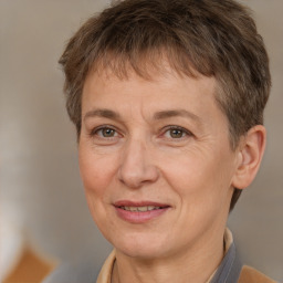 Joyful white adult female with short  brown hair and brown eyes