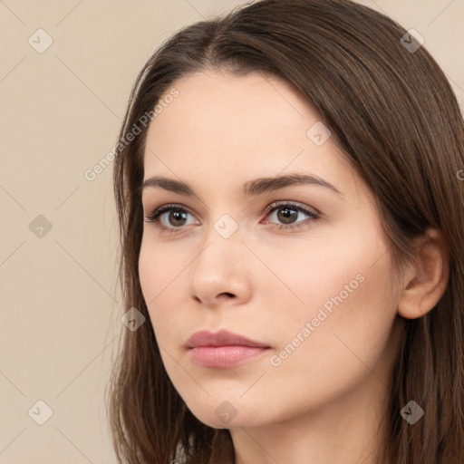 Neutral white young-adult female with long  brown hair and brown eyes