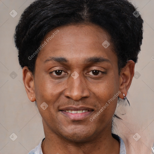 Joyful black adult male with short  black hair and brown eyes