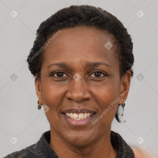 Joyful black adult female with short  brown hair and brown eyes