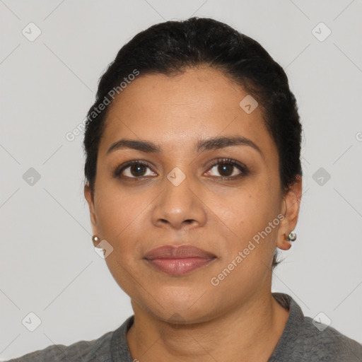 Joyful latino young-adult female with short  black hair and brown eyes