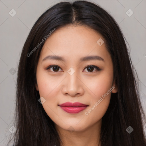 Joyful asian young-adult female with long  brown hair and brown eyes