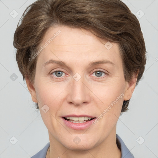 Joyful white adult female with short  brown hair and grey eyes