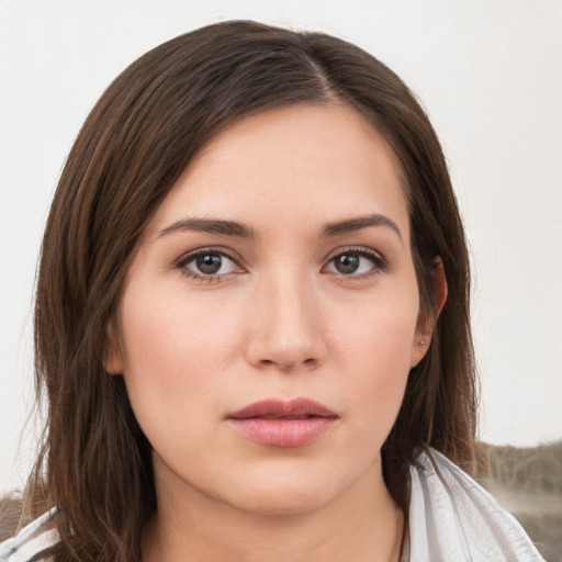 Neutral white young-adult female with long  brown hair and brown eyes