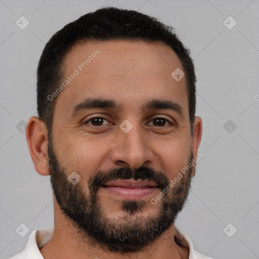 Joyful latino young-adult male with short  black hair and brown eyes