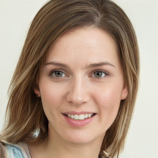 Joyful white young-adult female with long  brown hair and green eyes