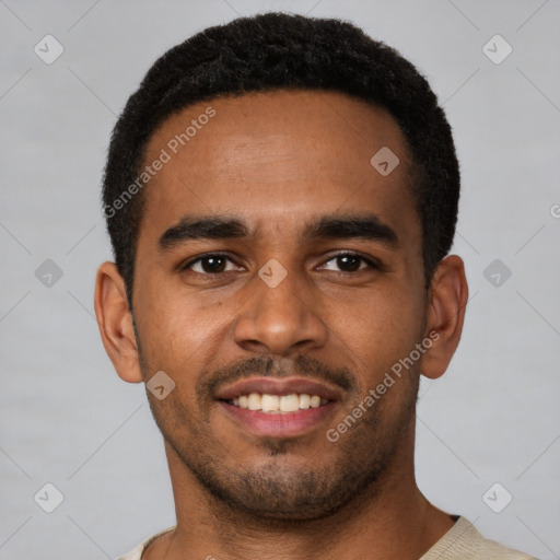 Joyful black young-adult male with short  black hair and brown eyes