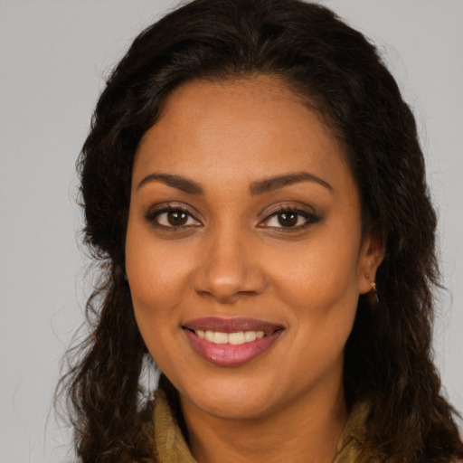 Joyful latino young-adult female with long  brown hair and brown eyes