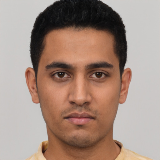 Neutral latino young-adult male with short  black hair and brown eyes