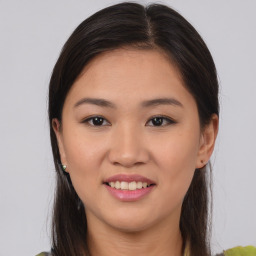 Joyful asian young-adult female with medium  brown hair and brown eyes