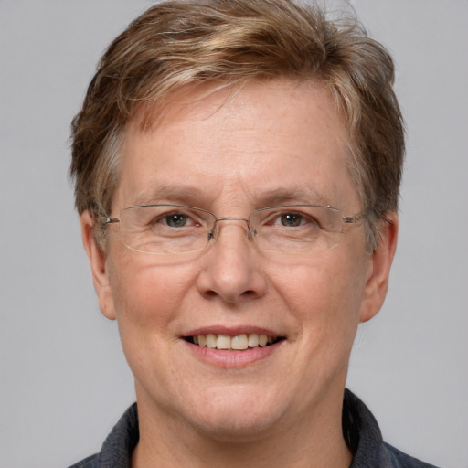 Joyful white middle-aged male with short  brown hair and grey eyes