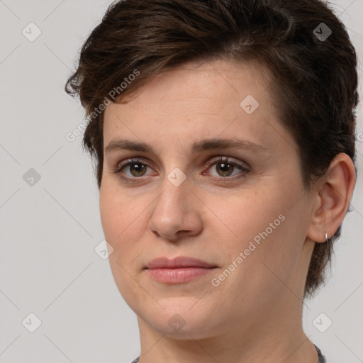 Joyful white young-adult female with short  brown hair and brown eyes