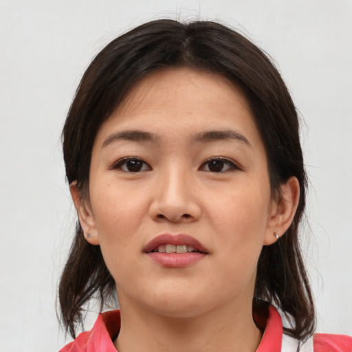 Joyful asian young-adult female with medium  brown hair and brown eyes