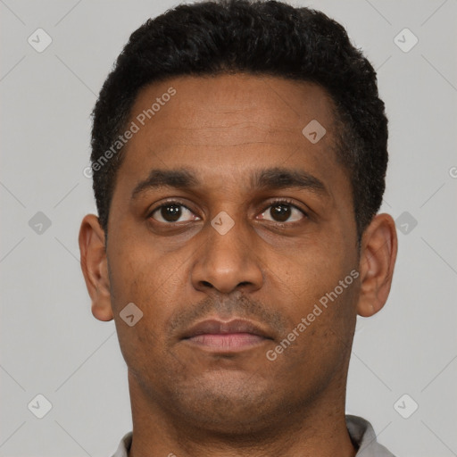 Neutral latino young-adult male with short  black hair and brown eyes