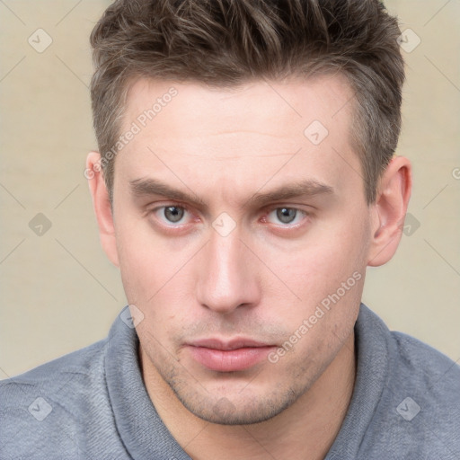 Neutral white young-adult male with short  brown hair and grey eyes