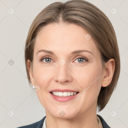 Joyful white young-adult female with medium  brown hair and grey eyes