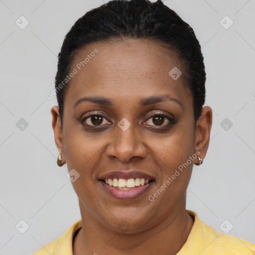 Joyful black young-adult female with short  brown hair and brown eyes