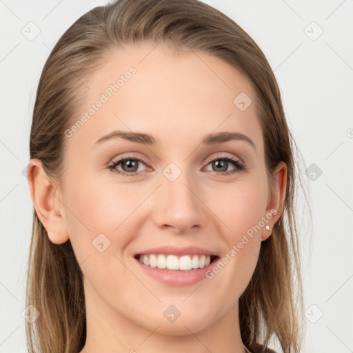 Joyful white young-adult female with long  brown hair and grey eyes