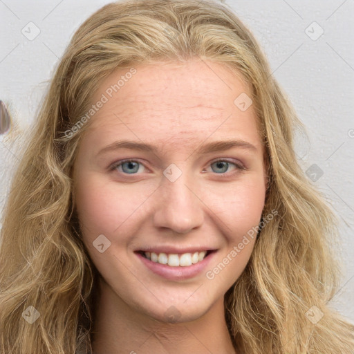 Joyful white young-adult female with long  brown hair and blue eyes