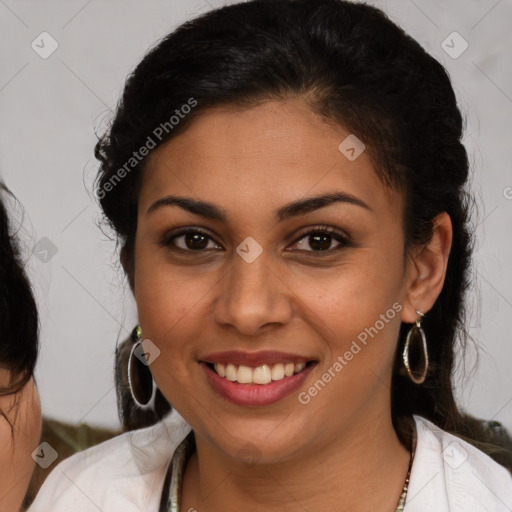 Joyful latino young-adult female with medium  brown hair and brown eyes