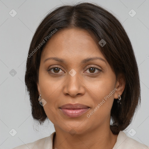 Joyful black adult female with medium  brown hair and brown eyes