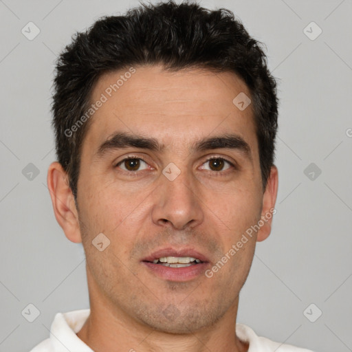 Joyful white adult male with short  brown hair and brown eyes