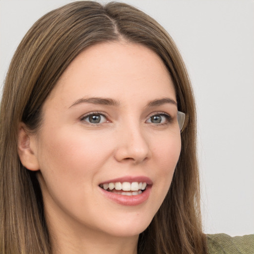 Joyful white young-adult female with long  brown hair and grey eyes