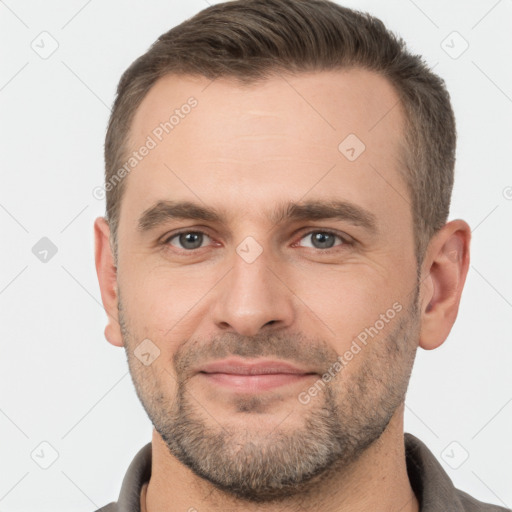 Joyful white adult male with short  brown hair and brown eyes