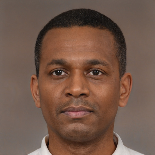 Neutral black young-adult male with short  black hair and brown eyes