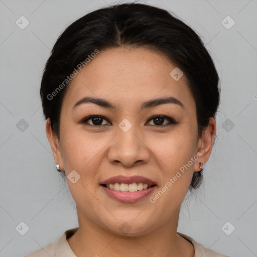 Joyful asian young-adult female with short  black hair and brown eyes