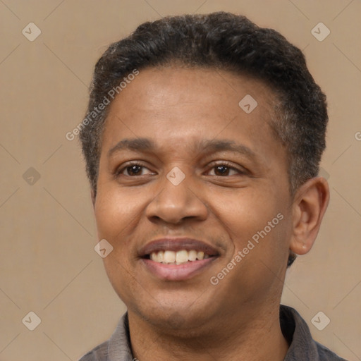 Joyful latino adult male with short  black hair and brown eyes