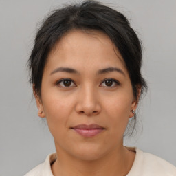 Neutral asian young-adult female with medium  brown hair and brown eyes