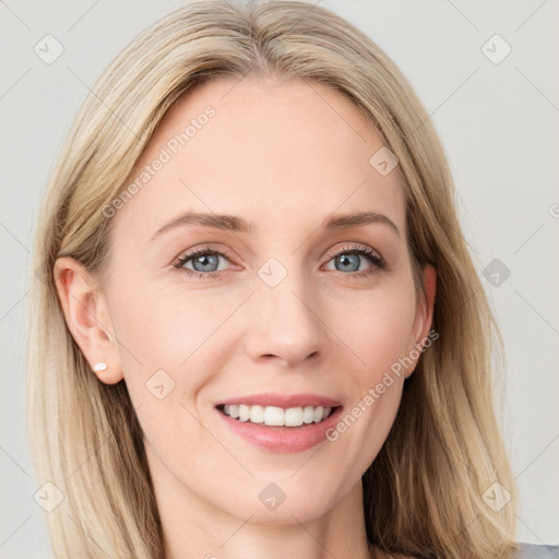 Joyful white young-adult female with long  brown hair and blue eyes