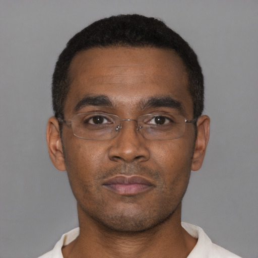 Neutral black young-adult male with short  black hair and brown eyes