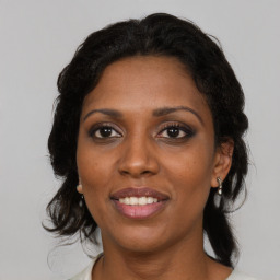 Joyful black young-adult female with medium  black hair and brown eyes