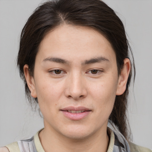 Joyful white young-adult female with medium  brown hair and brown eyes