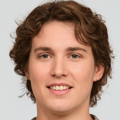 Joyful white young-adult female with medium  brown hair and green eyes