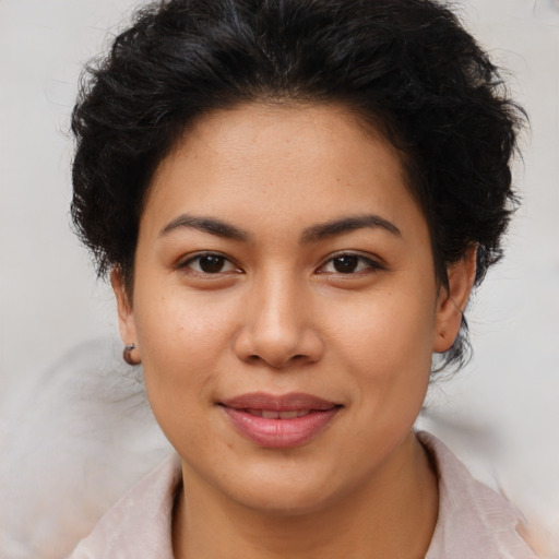 Joyful asian young-adult female with short  brown hair and brown eyes