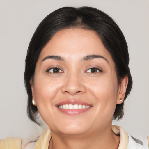 Joyful white young-adult female with medium  brown hair and brown eyes