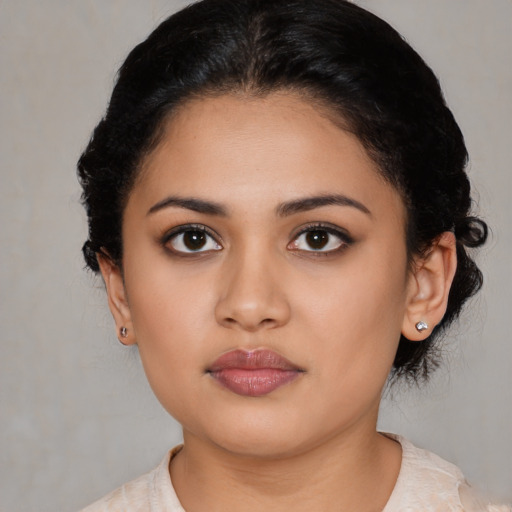 Neutral latino young-adult female with medium  black hair and brown eyes