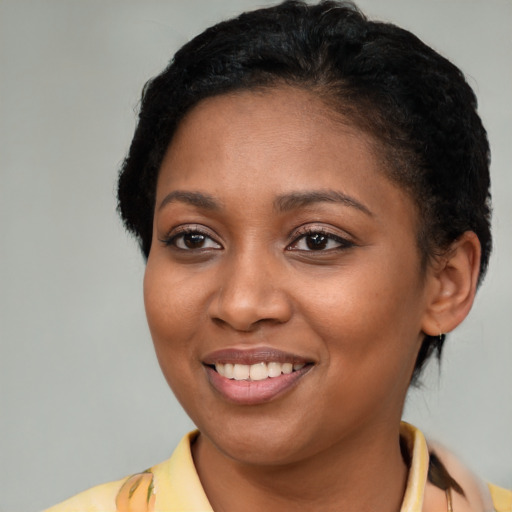 Joyful latino young-adult female with short  brown hair and brown eyes