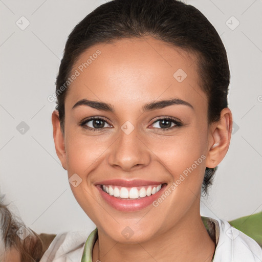 Joyful white young-adult female with short  brown hair and brown eyes