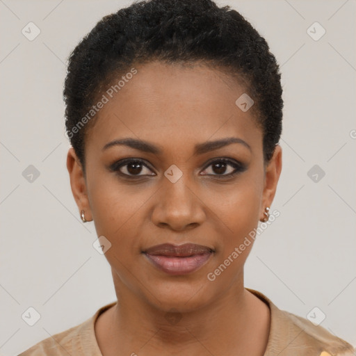 Joyful black young-adult female with short  black hair and brown eyes