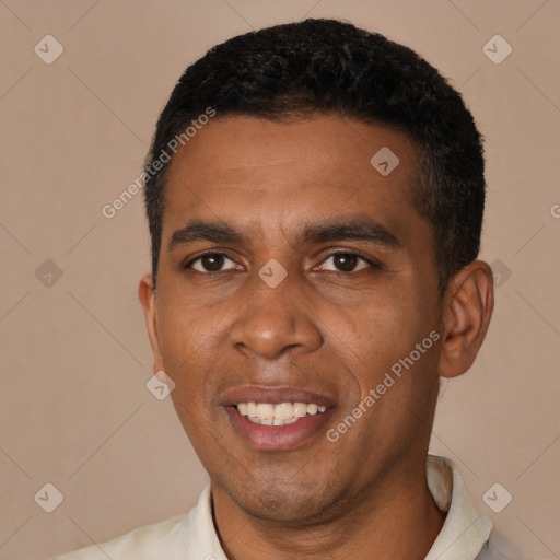 Joyful black young-adult male with short  black hair and brown eyes