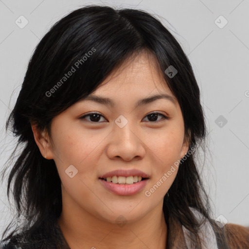 Joyful asian young-adult female with long  brown hair and brown eyes