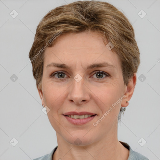 Joyful white adult female with short  brown hair and grey eyes