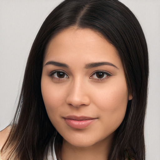 Joyful latino young-adult female with long  brown hair and brown eyes